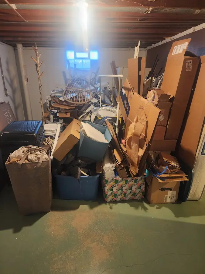 Roll-off dumpster container at job site for 4 Yard Dumpster Rental in Lansing